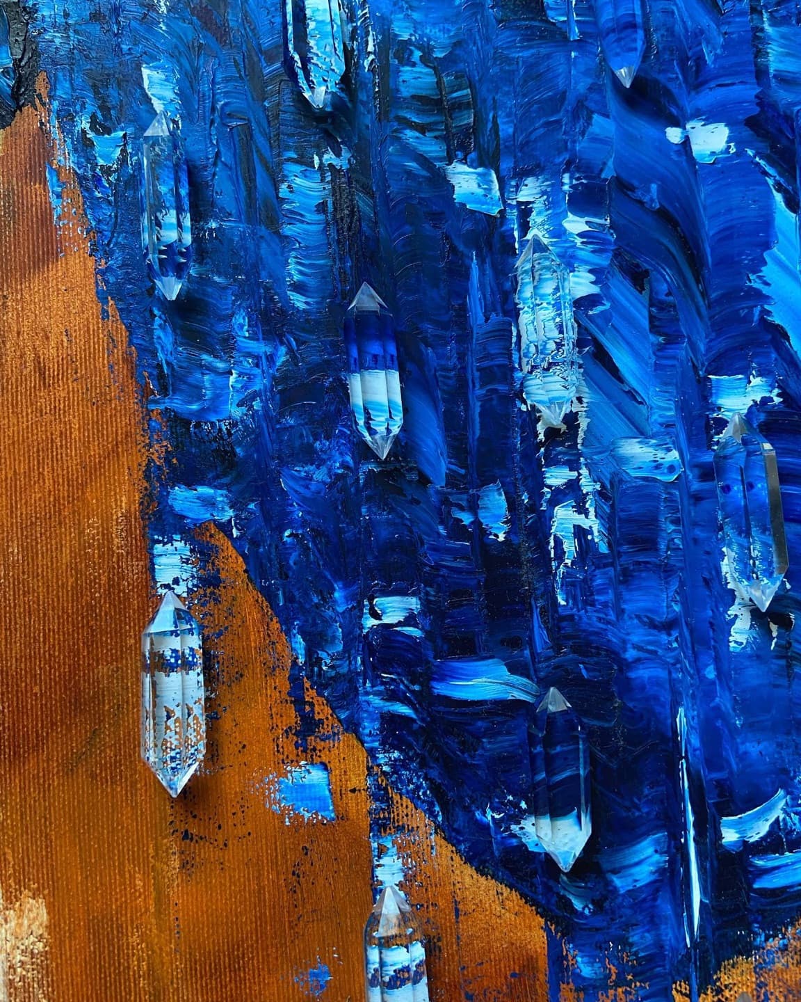 Close-up of the right wing: cast resin crystals set into thick vertical strokes of blue oil paint.